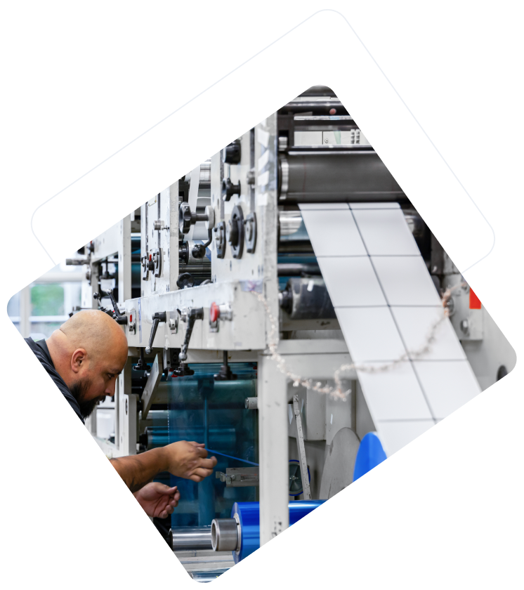 CleanMark technician preparing a machine used to make automotive labels
