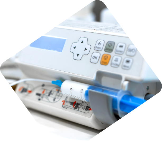 Close-up of medical device labels on the front of a machine